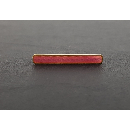 100 - PINK GUILLOCHE ENAMEL SET BAR BROOCH
in fourteen carat gold, 3.3cm long, with box marked 'W. T. Risi... 