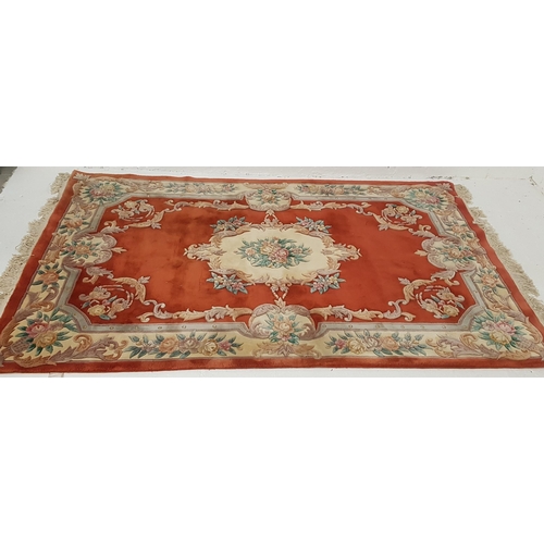 485 - CHINESE WASH RUG
the terracotta ground with floral motifs, fringed, 278cm x 182cm excluding fringe