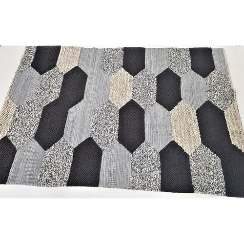 502 - TEXTURED GREY COLOURED RUG
with geometric panels in varying shades of grey, 238cm x 173cm