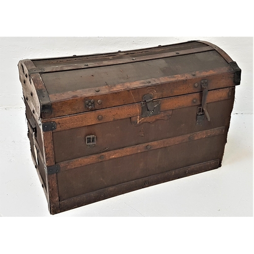 526 - DOME TOP ELM BANDED CABIN TRUNK
with a lift up lid and side carrying handles, bearing a trade label,... 