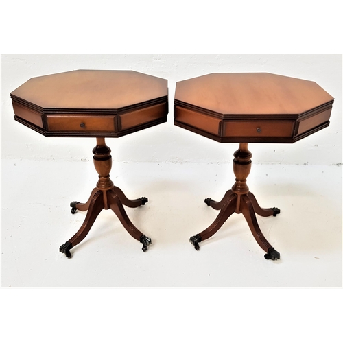 529 - PAIR OF YEW WOOD OCTAGONAL OCCASIONAL TABLES
each with two opposing paneled drawers, standing on a t... 