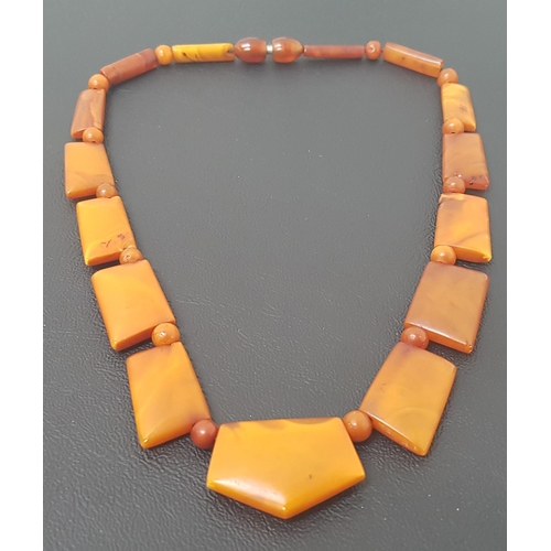 89 - ART DECO AMBER BEAD NECKLACE
with graduated shaped links and screw fastening, approximately 19.6 gra... 