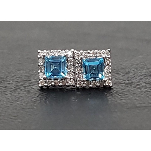 52 - PAIR OF BLUE TOPAZ AND DIAMOND CLUSTER EARRINGS
the central square cut blue topaz on each in diamond... 