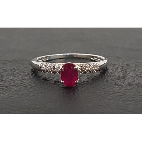 68 - RUBY AND DIAMOND RING
the central oval cut ruby approximately 0.4cts flanked by pave set diamonds to... 