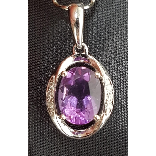 16 - AMETHYST AND DIAMOND PENDANT
the central oval cut amethyst flanked by three diamonds to each side of... 