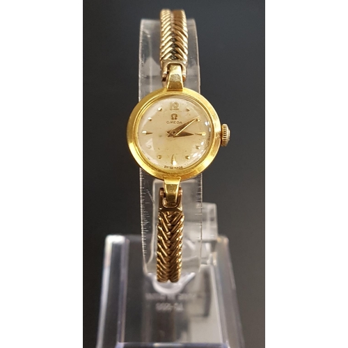 47 - LADIES EIGHTEEN CARAT GOLD CASED OMEGA WRISTWATCH
the dial with five minute markers, the seventeen j... 