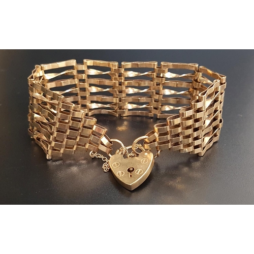 107 - NINE CARAT GOLD SEVEN BAR GATE BRACELET
with decorative twisted links, with nine carat gold heart pa... 