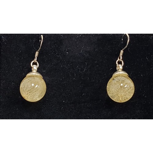 93 - PAIR OF SCOTTISH THISTLE SEED EARRINGS BY BOTANIC ISLES
the hand pressed flowers preserved in spheri... 