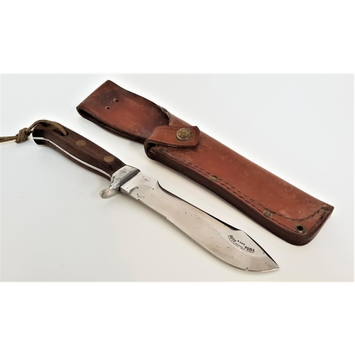 364 - PUMA AUTOMESSER BOWIE KNIFE
with a shaped 15.5cm long blade with saw teeth, the wood handle with thr...