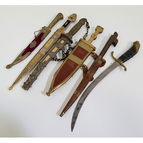 373 - SELECTION OF SIX DECORATIVE DAGGERS
including an Indian example with a 23cm long blade with a carved... 