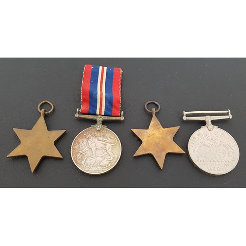 355 - GROUP OF FOUR WWII MEDALS
including The Africa Star, The 1939-1945 Star, The War Medal and ribbon an... 