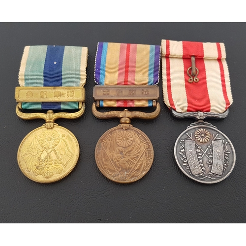 358 - THREE JAPANESE WAR MEDALS
including The 1937-45 China Incident War Medal, 1904/1905 Russo-Japanese W... 