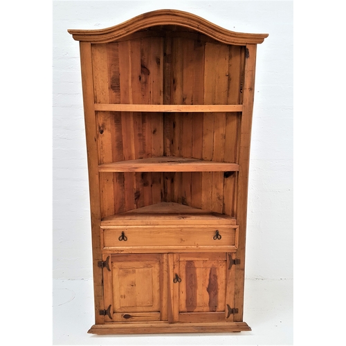 497 - TEAK FLOOR STANDING CORNER CUPBOARD
with an arched top above three open shelves with a paneled drawe... 