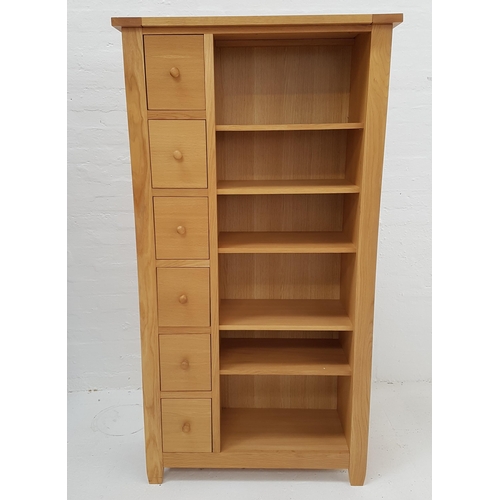 517 - LARGE LIGHT OAK SIDE CABINET
with a rectangular top above a bank of six drawers and six shelves, sta... 