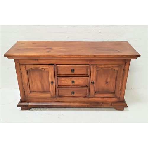 496 - TEAK SIDEBOARD
with a plain rectangular top above three central drawers flanked by a pair of arched ... 