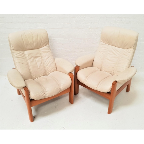 535 - PAIR OF EKORNES RECLINING ARMCHAIRS
in cream leather on teak shaped supports (2)