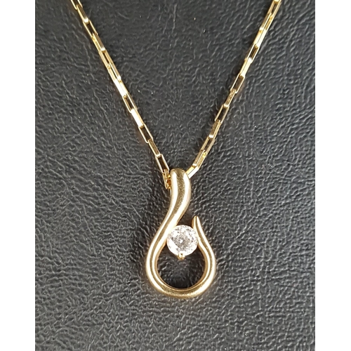 91 - CZ SET NINE CARAT GOLD PENDANT
the CZ gemstone to the centre of the scroll shaped pendent, approxima... 