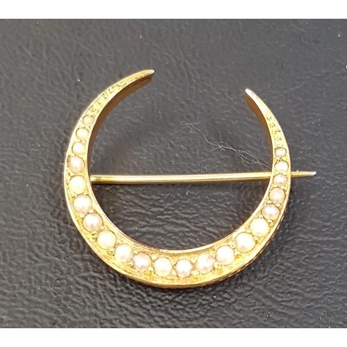 36 - EDWARDIAN SEED PEAR SET NINE CARAT GOLD CRESCENT BROOCH
approximately 2.5cm wide and 2,2 grams
