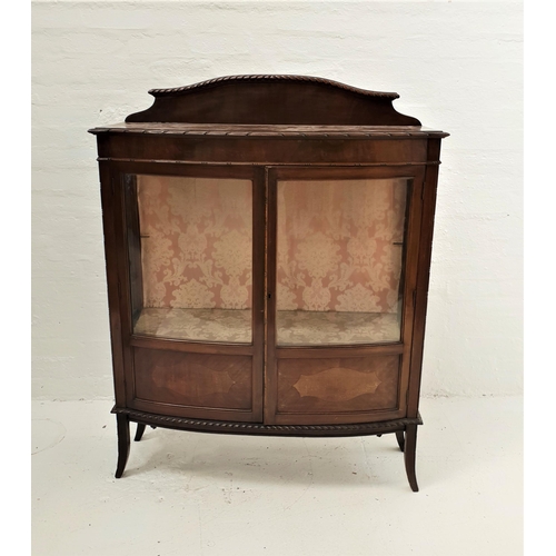 519 - BOW FRONT MAHOGANY DISPLAY CABINET
with a shaped raised back above a moulded top, the part glazed do... 