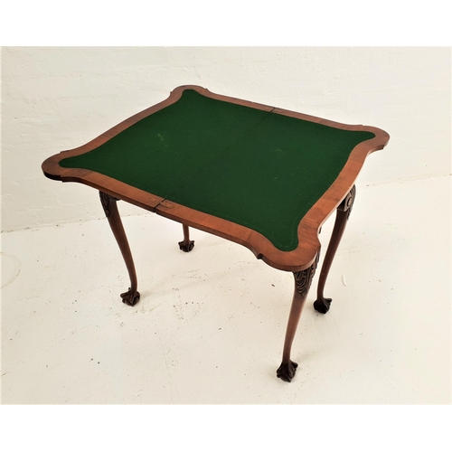 539 - SHAPED WALNUT CARD TABLE
with a rotating fold over baize lined top, standing on cabriole supports wi... 