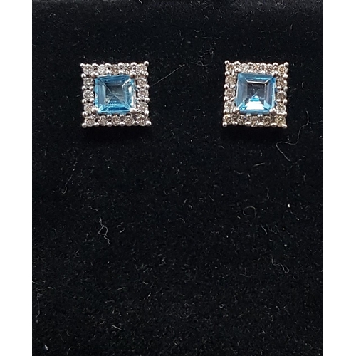 63 - PAIR OF AQUAMARINE AND DIAMOND CLUSTER EARRINGS
the central square cut aquamarines in diamond surrou... 