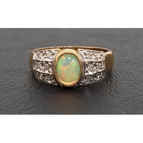 83 - OPAL AND DIAMOND CLUSTER RING
the central oval cabochon opal flanked by diamond set shoulders, on ni... 