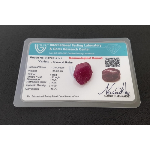 131 - CERTIFIED LOOSE NATURAL RUBY
the rough cut ruby weighing 31cts, with ITLGR Gemmological Report