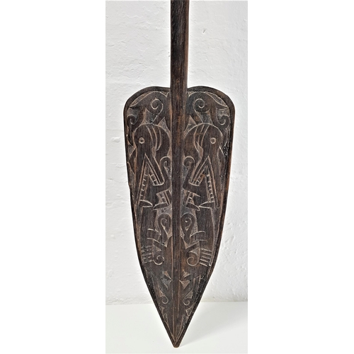 231 - CARVED WOOD INDONESIAN PADDLE
possibly Borneo, the carved handle with lizard eating tale, with shape... 