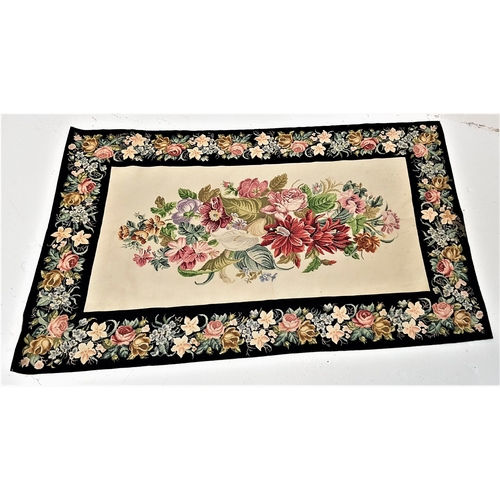 234 - KAFFE FASSETT EHRMAN TAPESTRY RUG
with a central cream ground with floral motifs, encased by a black... 