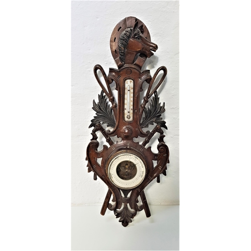 251 - CARVED AND STAINED PINE ANEROID BAROMETER
surmounted with a horse head and horseshoe with a thermome... 