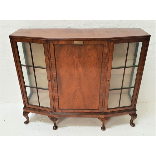 1771 - WALNUT BOW FRONT CABINET
the central paneled door with a brass presentation plaque,'Presented to the... 