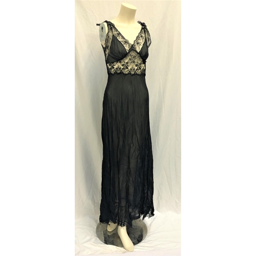 125 - MAE WEST OWNED BLACK LACE NEGLIGEE SET
the set consists of a gown and a robe. The set is made of a b... 