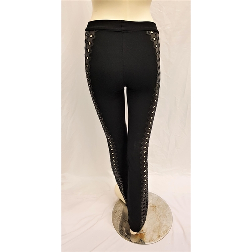 156 - CARMEN ELECTRA - BLACK STRETCH TROUSERS WITH FAUX LEATHER CUT OUT SIDES
by Cesar. Accompanied by Sta... 