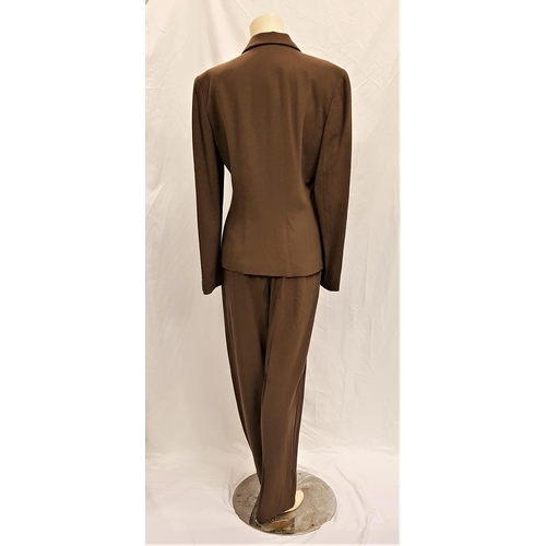 164 - MIMI ROGERS - CALVIN KLEIN SUIT
comprising jacket and trousers in olive green 100% wool. With Star W... 