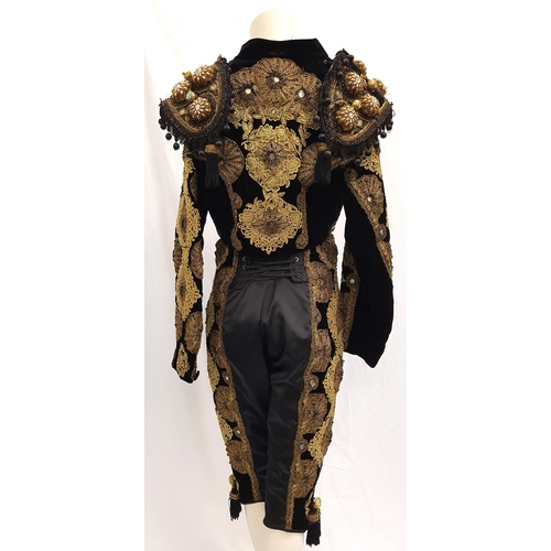 232 - SCOTTISH BALLET - SWAN LAKE - SPANISH 
the two piece costume comprising a black and gold embossed sh... 