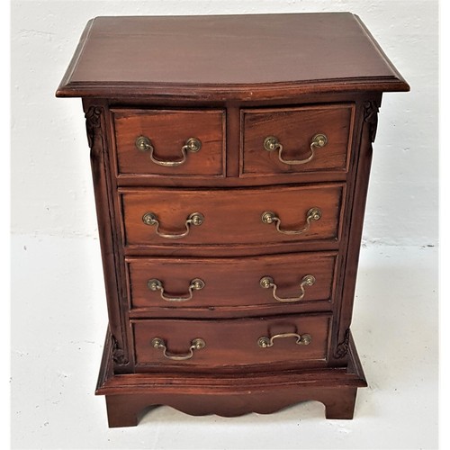 388 - TEAK SIDE CABINET
with a moulded top above a panelled frieze drawer with a panelled cupboard door be... 