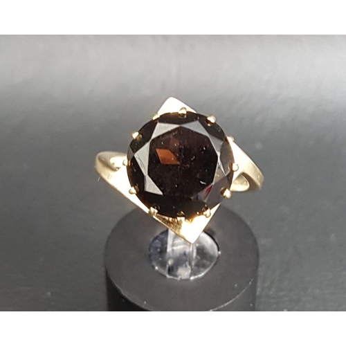 65 - UNUSUAL MALCOLM GRAY FOR ORTAK TOPAZ SINGLE STONE RING
the round brilliant cut smoky topaz on nine c... 