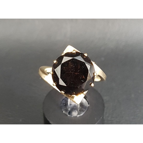 65 - UNUSUAL MALCOLM GRAY FOR ORTAK TOPAZ SINGLE STONE RING
the round brilliant cut smoky topaz on nine c... 