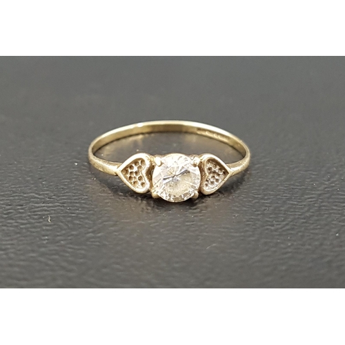 105 - CLEAR GEM SET DRESS RING
the central gemstone flanked by textured hearts, on nine carat gold shank, ... 