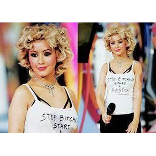 184 - CHRISTINA AGUILARA'S MTV AWARDS TOP AND SKIRT
accompanied by a photograph of her wearing the outfit
... 