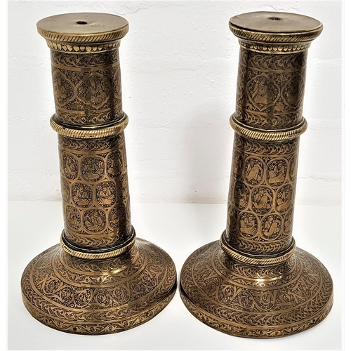 230 - PAIR OF BRASS ISLAMIC PERSIAN SAFAVID TORCH STANDS
raised on circular bases with embossed decoration... 