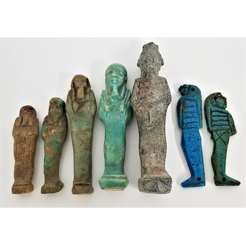 235 - FIVE EGYPTIAN GRADUATED FAIENCE USHABTI
one with carved hieroglyphs, 7cm-12.5cm high, together with ... 