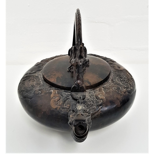 244 - CHINESE BRONZE KETTLE
of squat circular form, with a swing dragon handle, the body with a dragon spo... 