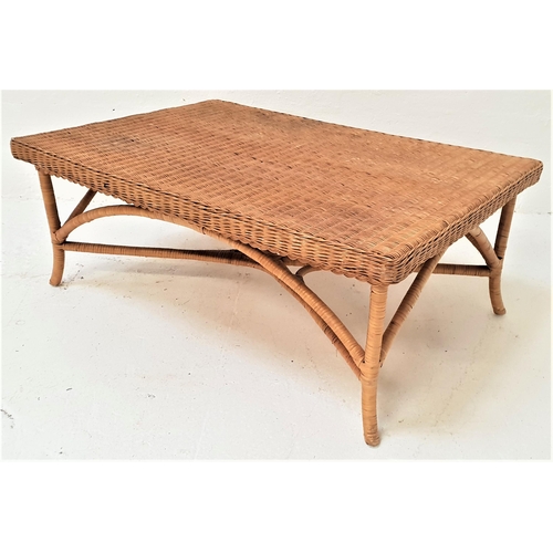 377 - LARGE CANED OCCASIONAL TABLE
with an oblong top standing on shaped supports united by a stretcher, 1... 