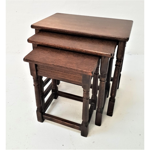 409 - NEST OF OAK OCCASIONAL TABLES
with rectangular tops, standing on turned supports united by a stretch... 