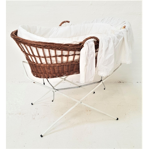 410 - WICKER CHILD'S CRIB
of shaped form with side carrying handles, foam mattress, liner and folding hood... 