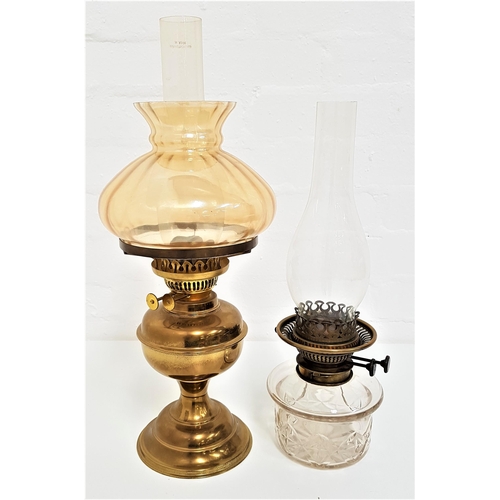 228 - VERITAS OIL LAMP
with a circular glass reservoir and brass wick holder with a glass stack, 40cm high... 