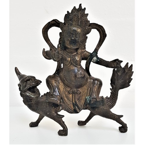 236 - CHINESE BRONZE GROUP
depicting a deity riding on the back of the mythical Qilin, 20cm high