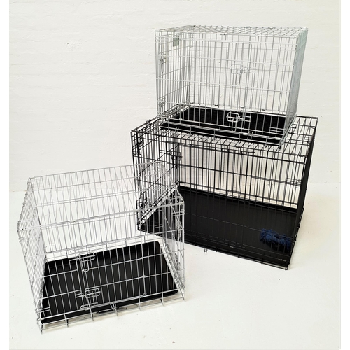 39 - THREE COLLAPSIBLE DOG CAGES
one larger size