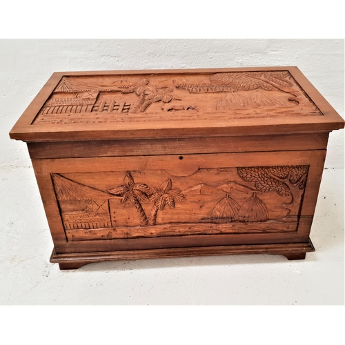 371 - EAST ASIAN TEAK CHEST
with carved panels overall, the lift up lid revealing a sliding tray, with sid... 